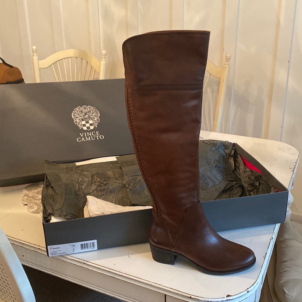 Tall brown Vince Camuto boots.